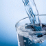 Pouring Water Into Glass On Blue Background - Allelets.Ru